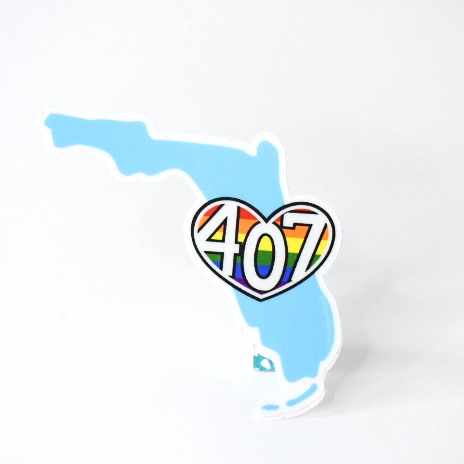 sticker of the map of Florida with a rainbow heart containing the number 407 on a white background