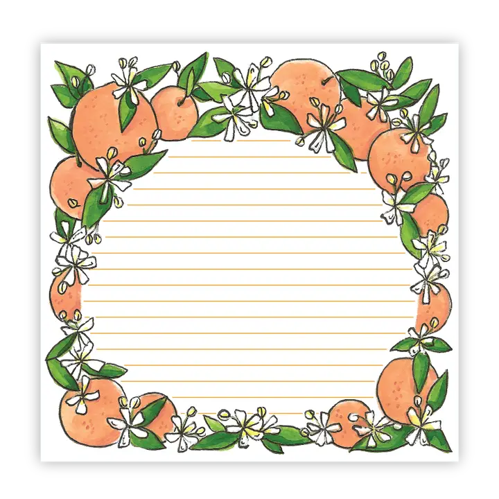 Oranges on a notepad.