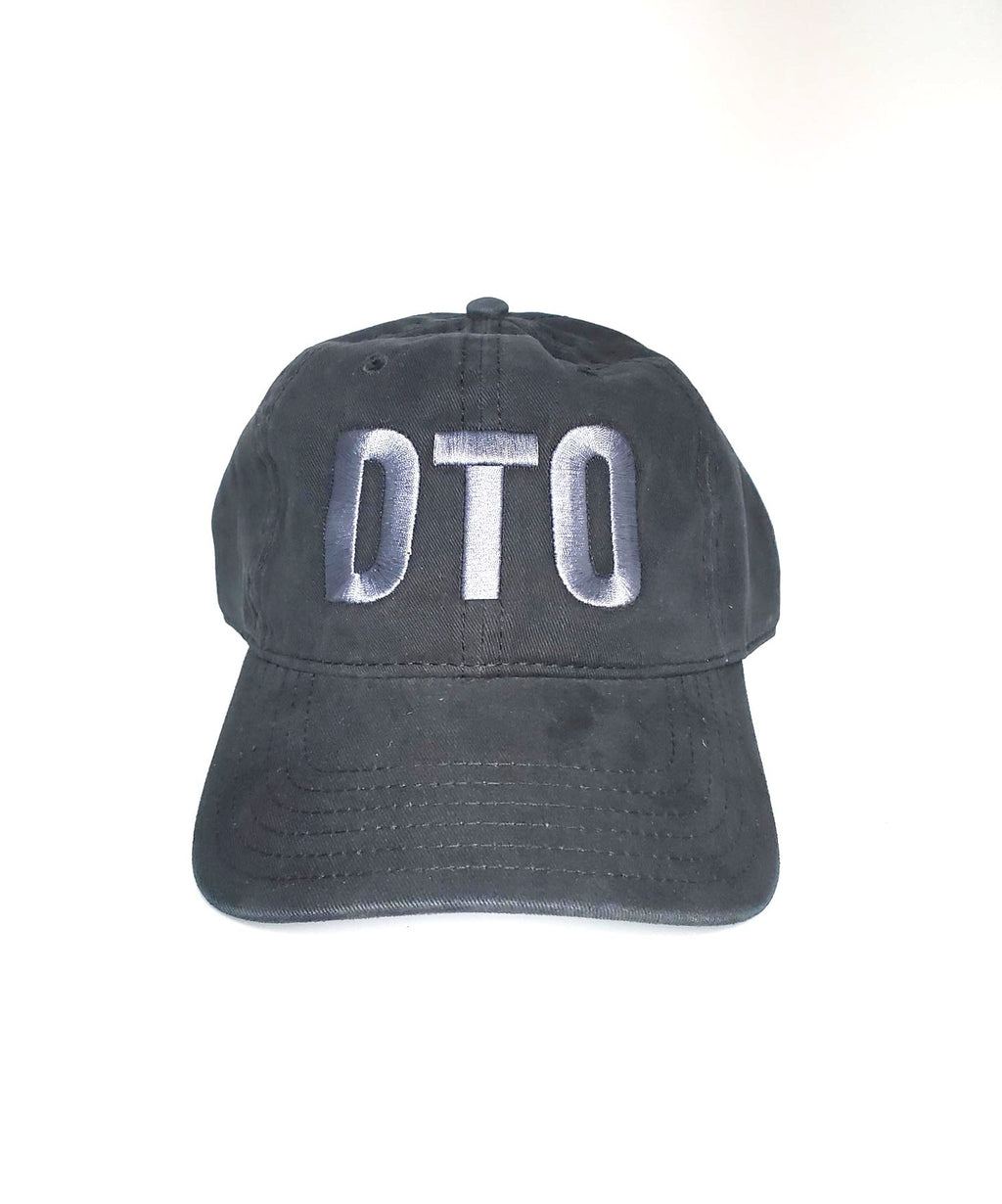 Black cap with 'DTO' embroidered on front of ball cap